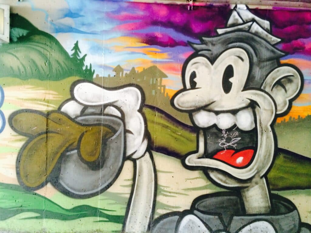 Street Art painting of a nostolgic coffee guy in artist Trent Call's signature cartoon style.