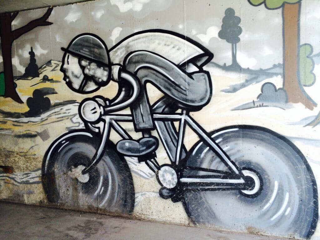 Street Art painting of a nostalgic road biker in artist Trent Call's signature cartoon style.