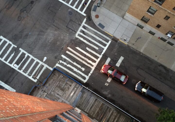 Photo of an intersection and cross walks taken from the 14th floor looking straight down in New York City