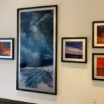 Gallery wall detail of Celestial Rhapsody and my sunset paintings!