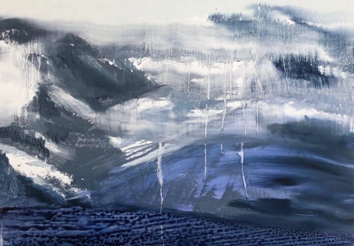 A deep blue pebbled forground fades into the melting snowy mountains shrouded in a foggy blur of drippy atmosphere.