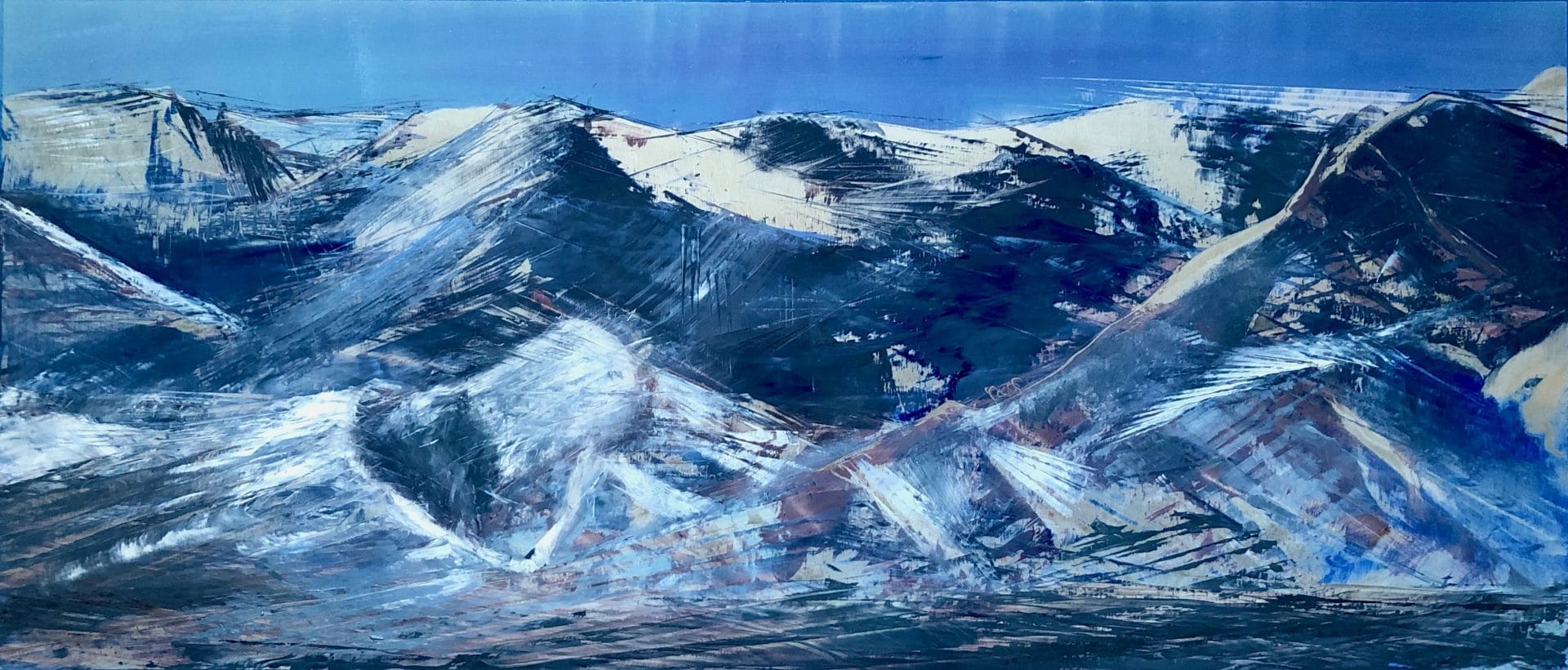 Blue and silver mountain scape of the Wasatch Mountains in Park City, Utah.