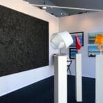 Sculpture and abstract paintings in the booth at the Monaco Yacht Show, 2019.