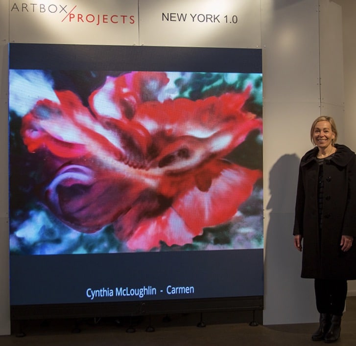 Cynthia McLoughlin, artist along side of the digital image of her painting, Carmen, at the Stricoff Gallery in Chelsey, NYC in 2018.