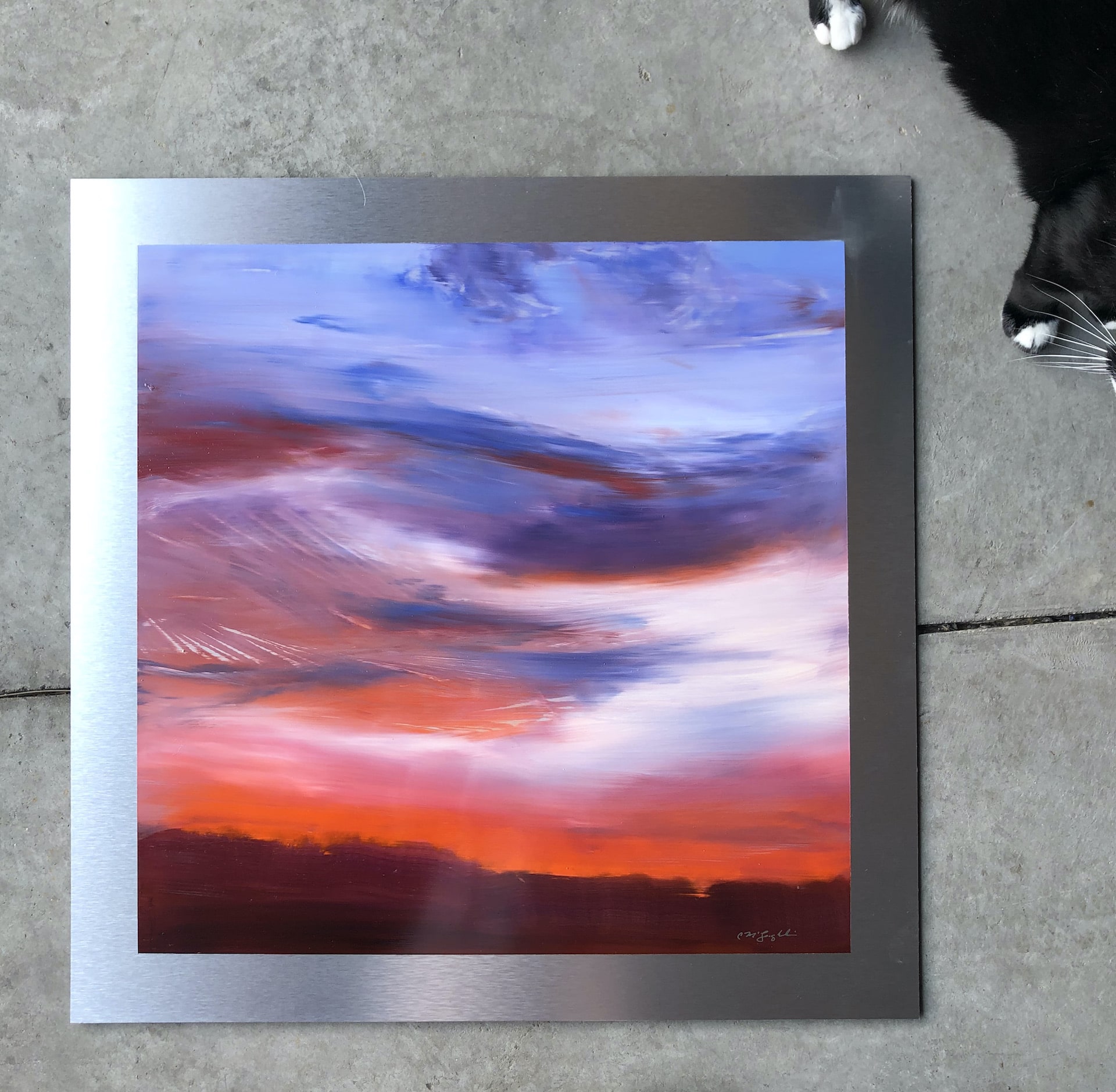 An original cloudscape oil painting on metal panel by artist Cynthia McLoughlin of an orange horizon with wispy blue/purple clouds.