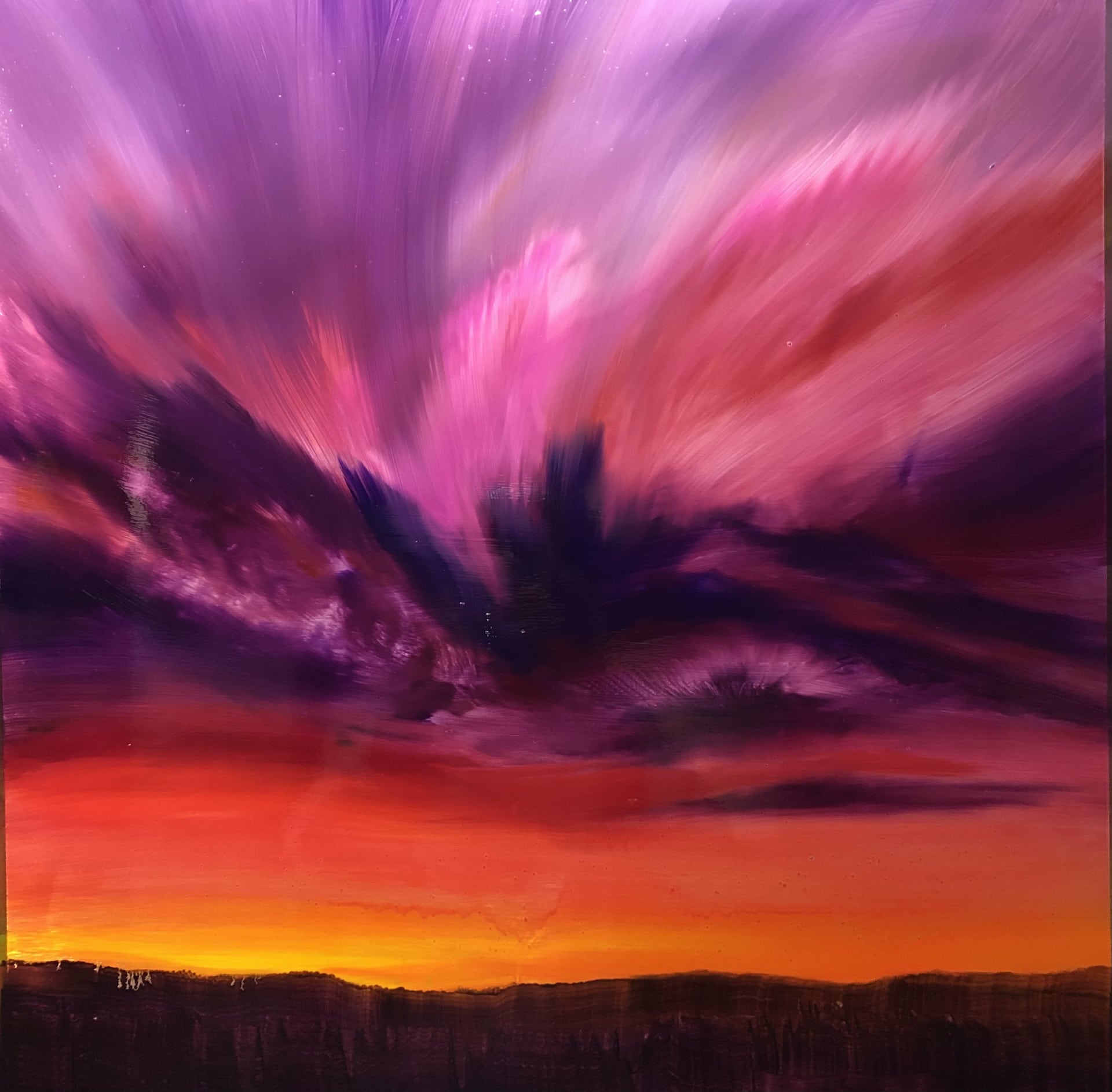 An original cloudscape oil painting on metal panel by artist Cynthia McLoughlin of an orange/purple/pink sunset over a mountainous silhouette..