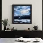 A contemporary mountain oil painting on metal panel by artist Cynthia McLoughlin of a winter storm.