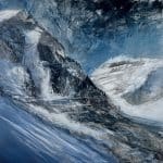 A contemporary mountain oil painting on metal panel by artist Cynthia McLoughlin