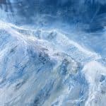 A contemporary mountain oil painting on metal panel by artist Cynthia McLoughlin