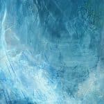 Abstract landscape painting with luminous layers of cool blues and silvery whites, suggesting the first light of dawn rising over distant mountains. Vertical strokes and soft gradients evoke a sense of upward movement and quiet anticipation.