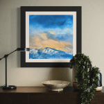 Last Run" original artwork detail. Textured oil on brushed aluminum painting showcasing expressive blues, indigos, and golden light over a snowy mountain landscape.