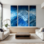 Triptych Celestial Drift with luminous sky and atmospheric mountai forms displayed in a contemporary living room.
