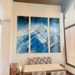 Triptych Celestial Drift with luminous mounmtain peaks and atmospheric sky in its forever Deer Valley home.